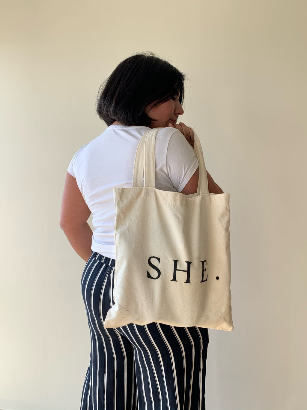 Tote SHE.